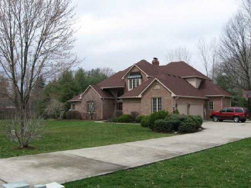 Two-story brick w bsm't on wooded, creek side in Foxcliff North. Master on main. Three beds up. Formal dine. Breakfast rm. Hearth rm. Kitchen w raised bar island. Two-story foyer & living room. Balcony overlook from open stair rail upper hall