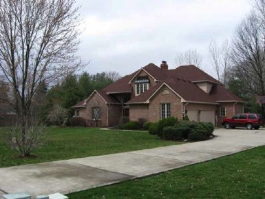 Two-story brick w bsm't on wooded, creek side in Foxcliff North. Master on main. Three beds up. Formal dine. Breakfast rm. Hearth rm. Kitchen w raised bar island. Two-story foyer & living room. Balcony overlook from open stair rail upper hall