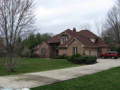 Two-story brick w bsm't on wooded, creek side in Foxcliff North. Master on main. Three beds up. Formal dine. Breakfast rm. Hearth rm. Kitchen w raised bar island. Two-story foyer & living room. Balcony overlook from open stair rail upper hall
