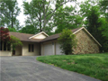 Exterior Front: Covered entry porch, brown stone & cedar perfectly set on top of vista surround by LAKEFRONT. Mature trees. Foxcliff Country Club offers full club amenities. Nearby equestrian, White River access, state forest, and small town living with a