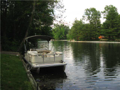 Lake/Water View: Concrete and timber dock at water's edge. Electric motors permissive use. Excellent water depth. Surrounded by other lake homes of significant size and lake living estate style. Always a breeze from open golf course southwest. Club amenit