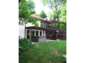 Exterior Back: Walk out area to east behind home. Multi level decks. Open concrete patio. Sun shades of natural materials. A very green home, energy efficient from passive solar with mega glass, good mechanicals, and native plantings. Retreat to vacation 