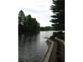 View: Foxcliff is "gateway to southern Indiana", 1/2 way between Indpls and I.U. campus @ Bloomington, 21 miles to metro airport, two major dual hwy for commuter, surrounded by aesthetically beautiful lakes, golf, creeks, river, & wooded uplands.