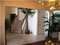 Two-story foyer. Tiled entry through back hall to laundry & powder bath