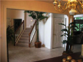 Two-story foyer. Tiled entry through back hall to laundry & powder bath