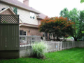 Privacy screen shelters in deck hot tub. Storage exist, a partial fenced yard, and abundant open yard edged by pines and hardwoods with passage to spillway creek.