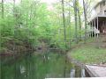 Foxcliff Lake East inlet creates lake access to two other homes west of the subject. Our property captures tunnel vision and open inlet frontage to the sunny east and large part of the lake. Lake East and West are connected creating a full day on H2O