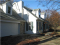 Detail on exterior include crown window heads, dentil molding, shutters, double hung windows with stained grills, traditional clap board siding, paneled doors, dimensional shingles, stone accents in walks, fireplace chimneys, and garage returns.