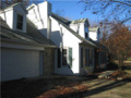Detail on exterior include crown window heads, dentil molding, shutters, double hung windows with stained grills, traditional clap board siding, paneled doors, dimensional shingles, stone accents in walks, fireplace chimneys, and garage returns.