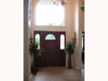 Two story foyer. Tiled entry through back hall to laundry & powder bath.