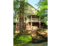Filtered sunlight from east lake side. S/W summer breeze from golf course 400 yds away cools deck and lower level walkout area. Rutland Lane loops, creating access but limits traffic. Estate size properties give an owner low density with privacy