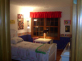 Bedroom 3: Rear loaded view via two wide window. Hardwood floors. Walk in closet.