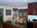Breakfast Area/Room: Bay panorama of back wooded area and Foxcliff Lake South from breakfast area deck. Hardwood floors create hard surface for easy maintenance and natural beauty.
