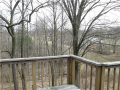 Exterior east view from upper level living area is very private, wooded, and territorial in view across the adjacent equestrian estate. You share your retreat with deer, turkey, ferns and fauna.