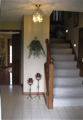 Entry: Two story foyer. Splatter textured walls. White Ash hardwood flooring. Painted stair risers with stained hardwood treads and painted balusters. Sloped ceiling. Bi-level splits upper level kitchen & dining with three beds and two baths. Lower level 