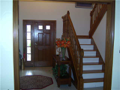 Entry: Two story grand foyer. Hardwood stairs. Tiled floor. Stained ww. Oversized casings and fluted jambs. Powder 1/2 bath. Natural light from window above and door sidelight. Wall space design for furniture decor. Large C/O into dine & family rms.