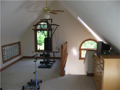 Exercise Room: Loft area at top of stairs is currently an exercise room. The area may label and serve as a nursery near the master, an office, an art studio, or convert to a mega walk in off-season storage closet.