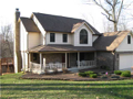 Exterior Front: PERFECT ! Situated above wooded ravine overlook Foxcliff South Lake. Open lawn to south side and east front. Two story center hall traditional American home with walk out lower level. Bonus rm above two car attached (with storage offset). 