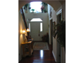 In grand style, guests are greeted under cover at front porch, invited into a volume of space. Dramatic balcony overlook, two story entry w plant shelf and architectural designed window. Vogue iron & wood railings, beautifully lighted, wood treads & riser