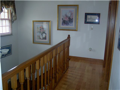 Interior Space/Layout: Substantial wood railings with hardwood floors. Less scuff marks and more easily maintained than painted woodwork. Upper bed hall pictured. Wall space for decor painting. Natural light for two story foyer and bed passage. Never repl