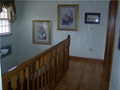 Interior Space/Layout: Substantial wood railings with hardwood floors. Less scuff marks and more easily maintained than painted woodwork. Upper bed hall pictured. Wall space for decor painting. Natural light for two story foyer and bed passage. Never repl