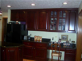 Kitchen: Lineal footage of counters is exceptional. Corner glass above sink captures lake view through mature trees. Recessed can lighting, wide passage around center island, ample space to both sides of cook top, good time and motion to wash and dishwash