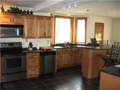 Kitchen: What a sink bay area. Cool design. Take the tour. This kitchen is with planning desk, walk in pantry, stepped up breakfast bar, fully applianced, stepped plate line for wall cabinets, directional lighting, and layered ceilings.