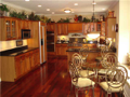 Oh Yes! I wanted sold hardwood cherry floors and cabinets with SS appliances and granite counter tops. Oh, Yes! Make it big with a peninsula and bay window breakfast area for casual dining. Plenty of lighting, please. Top shelf. Top drawer. Top of line!