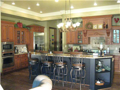 Kitchen is fully applianced, neutral decor, adjacent the breakfast area, and garage accessible.
