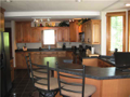 Kitchen: Maple cabinets with shadow glaze, multi windows to include boxed out bay @ sink, raised breakfast bar, walk in pantry, stainless steel fully applianced, ceramic tiled floors, wet bar as buffet, with additional breakfast room.