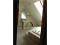 Master Bath/Spa: Here is the tub beneath clearstory windows. Jetted and pulsing, this water flow will push sweetness to the point of pampering.