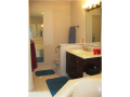 Master Bath/Spa: All ceramic floor tile, platform wrpl tub and wall surround, skylight in master closet, dbl slider window above corner tub. Seperate shower with glass surrond. Lots of natural light.