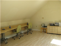 Office: A part of the studio/office located above the garage area.