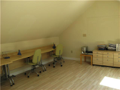 Office: A part of the studio/office located above the garage area.