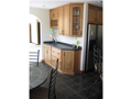 Wet Bar: Wet bar doubles as additional counter for buffet to formal dining adjacent or more intimate breakfast bay area.