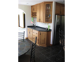 Wet Bar: Wet bar doubles as additional counter for buffet to formal dining adjacent or more intimate breakfast bay area.